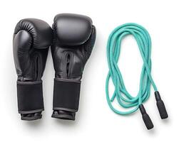 Boxing gloves and jump rope set for training and fitness routines at home or gym photo