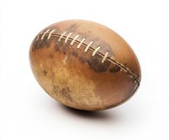 A weathered rugby ball displaying signs of wear and tear on a white background photo