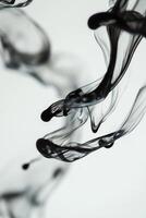 Macro photography of a drop of ink dispersing in water creating fluid shapes and abstract forms with intricate swirls and patterns - Variant 29 photo