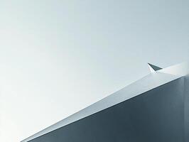 Minimalist paper plane soaring in clear blue sky symbolizing freedom, ambition, and simplicity in a vibrant composition photo