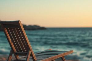 Wooden deck chair facing serene ocean waves at golden hour relaxing coastal scenery beachside tranquility photo