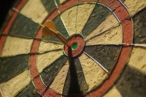 Close up of a dartboard with a single dart hitting the bullseye in dramatic lighting photo