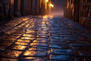 Moody cobblestone street illuminated by warm lights after rain evoking nostalgia and cinematic urban atmosphere photo