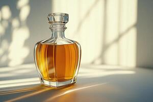 A sleek glass bottle filled with some golden liquid, illuminated by soft sunlight, sits in a minimalist setting with elegant shadows. photo