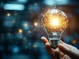 Glowing lightbulb held in hand with intricate golden light trails representing ideas innovation and creativity copyspace photo