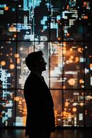 Business professional silhouette with colorful technological data display background symbolizing innovations photo
