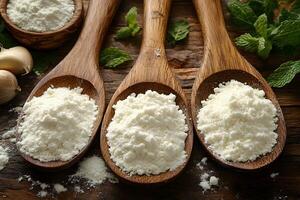Culinary Essentials Wooden Spoons with Powdered Flour on Rustic Table photo