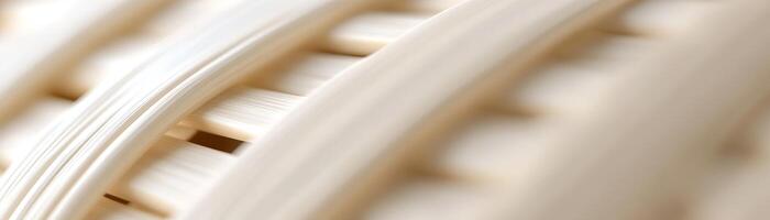 Soft light reflections enhance the intricate woven rattan texture in light beige hues. This stylish, organic background is ideal for digital projects, offering a clean space for text photo