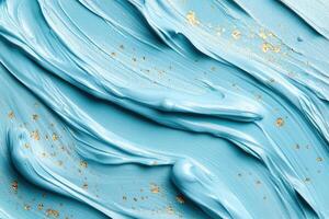Featuring gentle brush strokes in pastel blue shades adorned with subtle gold specks, this artistic background provides a modern and serene canvas perfect for text overlays or creative designs photo