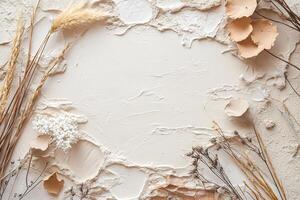 This artistic backdrop showcases abstract clay shapes in calming shades of white, beige, and light brown, surrounded by delicate dried flowers and grasses. Ideal for text overlays photo