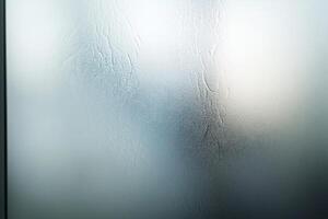 Frosted glass creates a sophisticated effect with soft light reflections against a smooth neutral backdrop, ideal for modern fashion presentations or stylish overlays photo