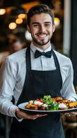 Smiling Waiter Serving a Delicious Restaurant Meal photo