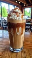 Caramel Iced Coffee in a Glass Cup photo