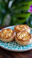 Three golden pastries on a teal plate photo