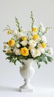 Stunning White and Yellow Floral Arrangement in Ornate Vase photo
