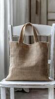 Rustic Beige Canvas Tote Bag on a White Chair photo