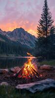 Serene Mountain Sunset Campfire by the Lake photo