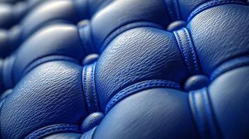 Quilted fabric demonstrates rich padded texture diamond stitch pattern highlighted soft sheen and vibrant blue color creating modern and inviting atmosphere photo