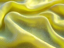 Neon green synthetic mesh fabric features open weave and elastic texture enhances its athletic look. Bold lighting highlights intricate details and sporty aesthetic photo