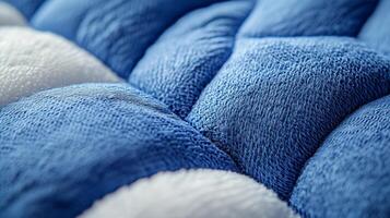 Close up of quilted fabric highlights detailed diamond stitch pattern and plush texture exudes modern comfort and vibrant design elements suitable for various applications photo