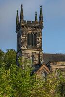 A large stone church with a tower photo