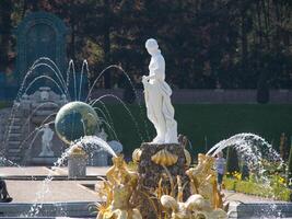 A statue of a woman in a fontain photo