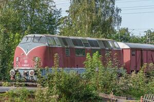 A red and white train on the track photo