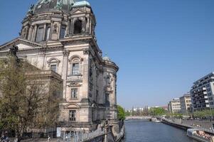 A large building with a dome on top in berlin germany photo