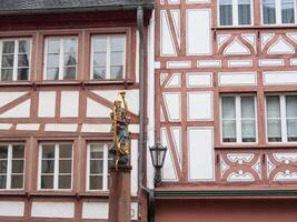 A statue of a man standing in front of a building photo