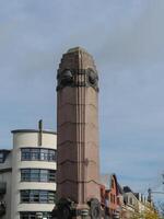 A large building with a clock tower in nijmegen photo