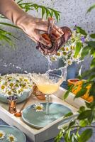Bartender pouring cocktail into elegant glass, creating splash with jigger photo