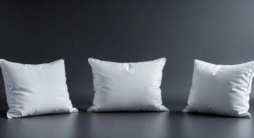 Three Empty White Cushions on Black Background for Creative Use photo