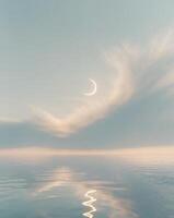 Peaceful cloud over reflective ocean with crescent moon in tranquil sky photo