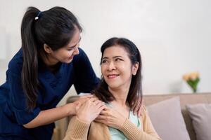 Caring caregiver creating a joyful atmosphere with elderly client through comfort and companionship at home photo