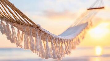 serene hammock with fringes swaying gently at sunset, surrounded by tranquil beach atmosphere. Perfect for relaxation and enjoying nature beauty photo