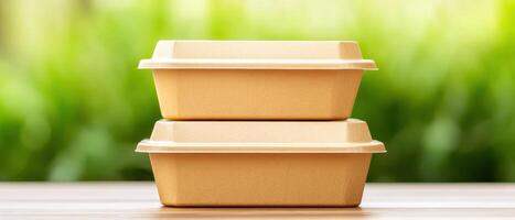 Biodegradable takeout containers stacked on wooden table, showcasing eco friendly packaging. Perfect for sustainable dining and reducing plastic waste photo