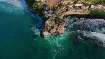 Aerial view of scenic rock near Balangan beach with ocean in Bali. video