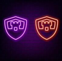 Glowing neon line shield with crown icon isolated on black background. Colorful outline concept. vector
