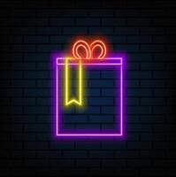Glowing neon Gift box icon isolated on black background. Merry Christmas and Happy New Year. neon style. vector
