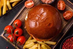 Delicious burger with beef salt and spices photo