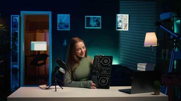 Cheerful girl mixing on DJ turntables, doing music production tutorial for online streaming channel. Smiling young content creator playing around with stereo sound mixer, camera B video