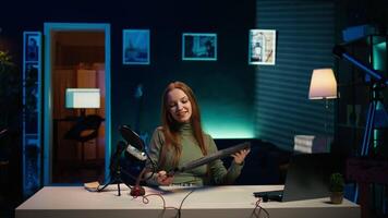 Happy influencer testing keyboard and mouse while doing review in personal studio to see if price is justified. Cheerful media star showcasing computer peripherals features to audience, camera B video