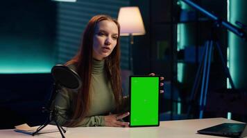 Tech guru excited to review newly released mockup tablet, comparing features with older models. Influencer filming for social media, analyzing latest generation of green screen device, camera A video