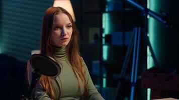 Social media star uses professional gear to capture welcoming intro for vlogging channel, interacting with online community. Influencer connects with loyal fanbase during live stream, camera A closeup video