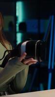 Vertical Tech specialist filming sponsored content, unboxing newly released VR glasses product to make fans buy it. Entertainer amazed by product, presenting virtual reality headset to subscribers, camera A video