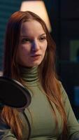 Vertical Social media star uses professional gear to capture welcoming intro for vlogging channel, interacting with online community. Influencer connects with loyal fanbase during live stream, camera A closeup video