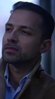 A Thoughtful Man is in an Urban Setting Dressed in Elegant Attire and Stylish Clothing video