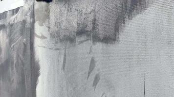 Charcoal marks create intricate textures and patterns on the canvas in a contemporary art studio, showcasing unique artistic techniques and expression video