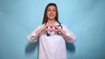 Smiling Doctor Making Heart Shape with Hands video