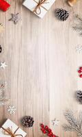 Top view Christmas composition with gifts and decorations at the top and bottom, featuring an empty space in the center, perfect for holiday greetings photo